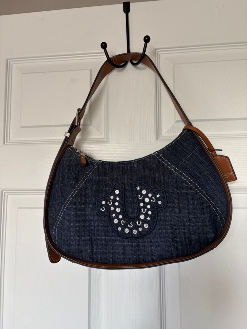 True Religion Dark Denim Shoulder Bag with Brown Trim and Rhinestone Logo